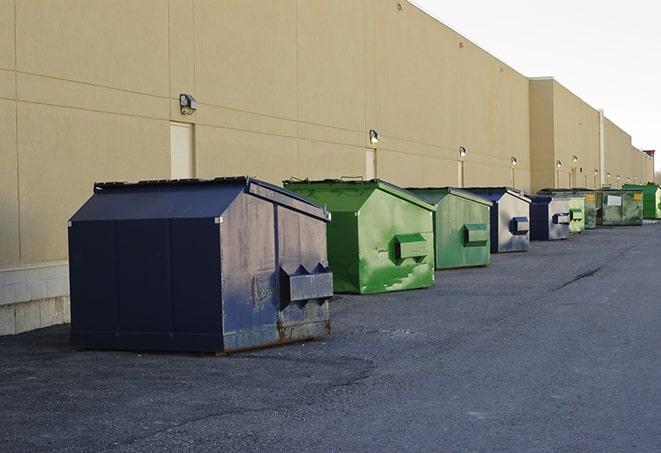 piles of waste and debris collected in construction dumpsters in Lead